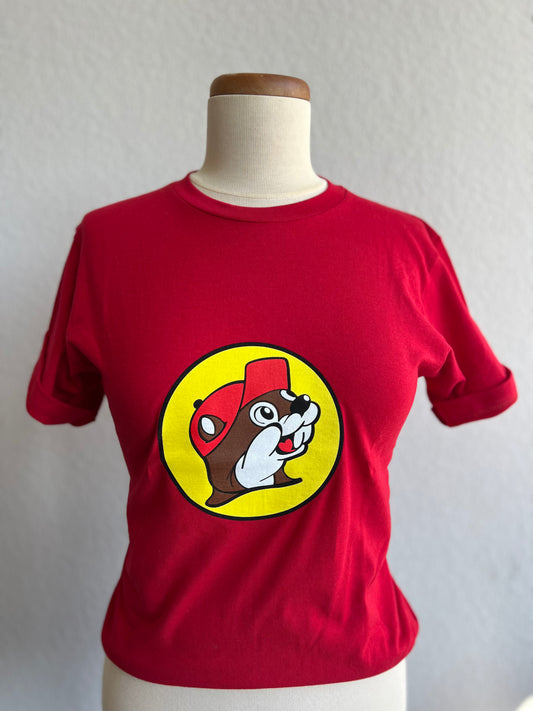 Classic red Buc-ee's tshirt with a yellow circle and beaver in the middle